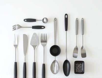 Selection of modern kitchen gadgets and stainless steel utensils.